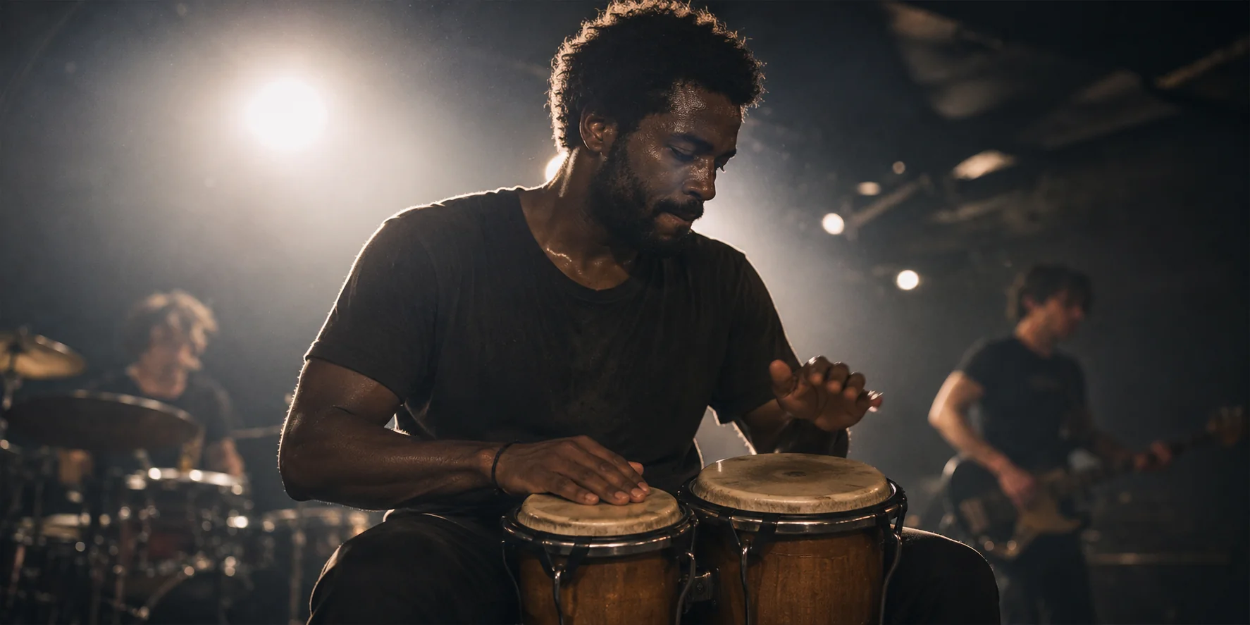 A person playing bongos